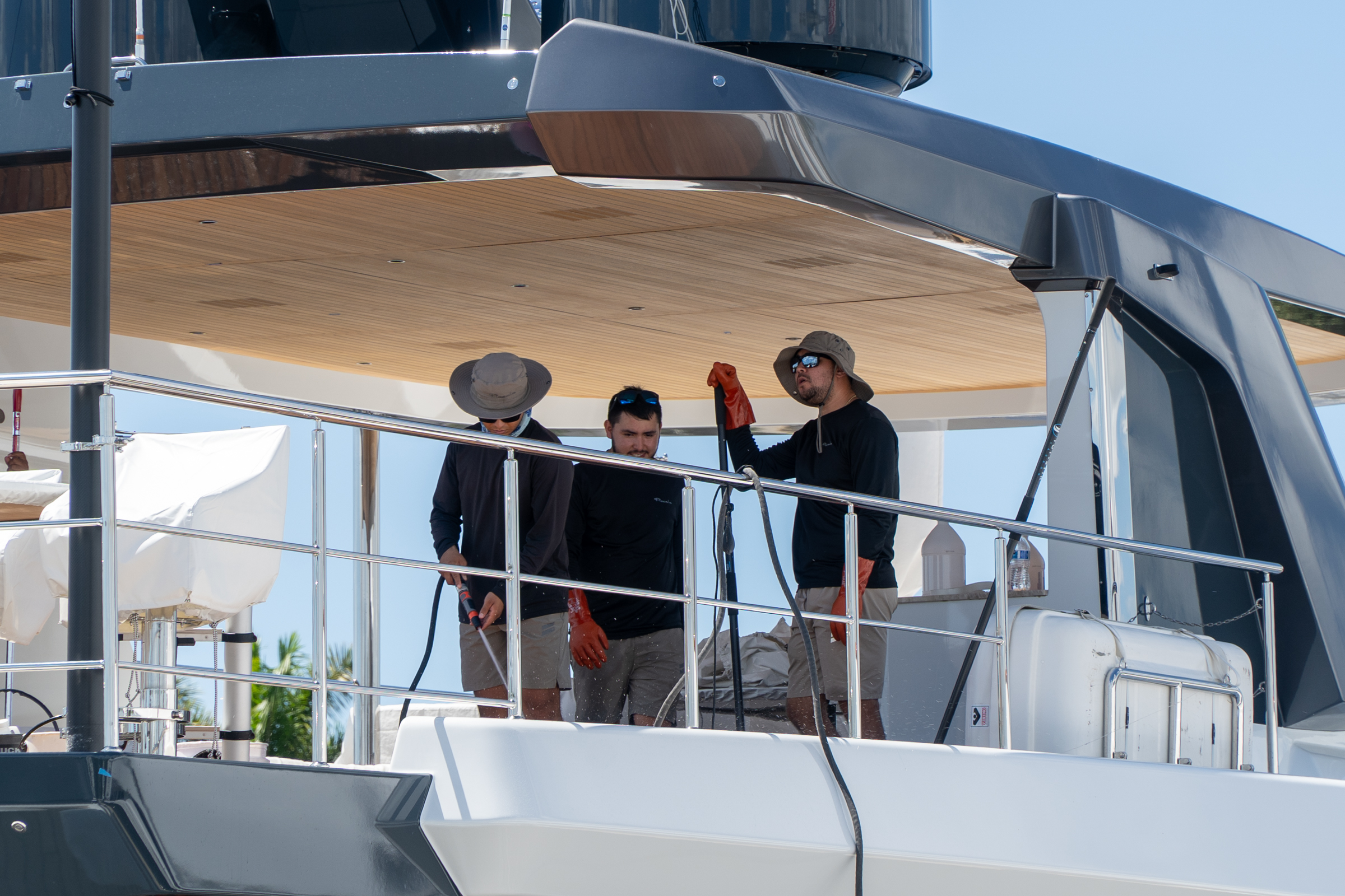Yacht crew team working together on the aft deck