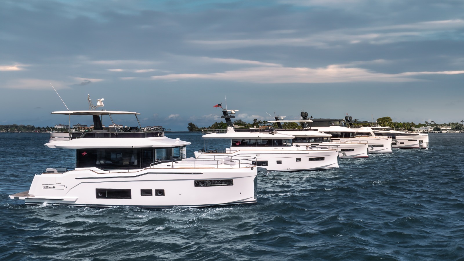 Sirena yacht fleet in formation on South Florida water — Three Marine managed vessels